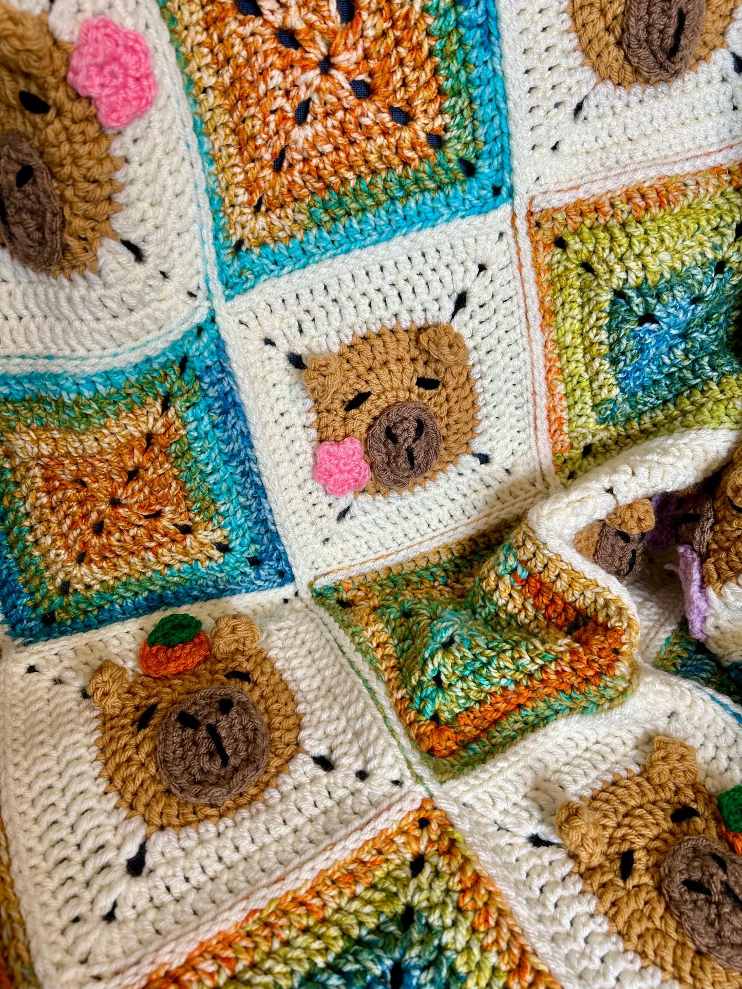 Capybara crochet blanket pattern. PDF download, UK and US terms. Bright colors.