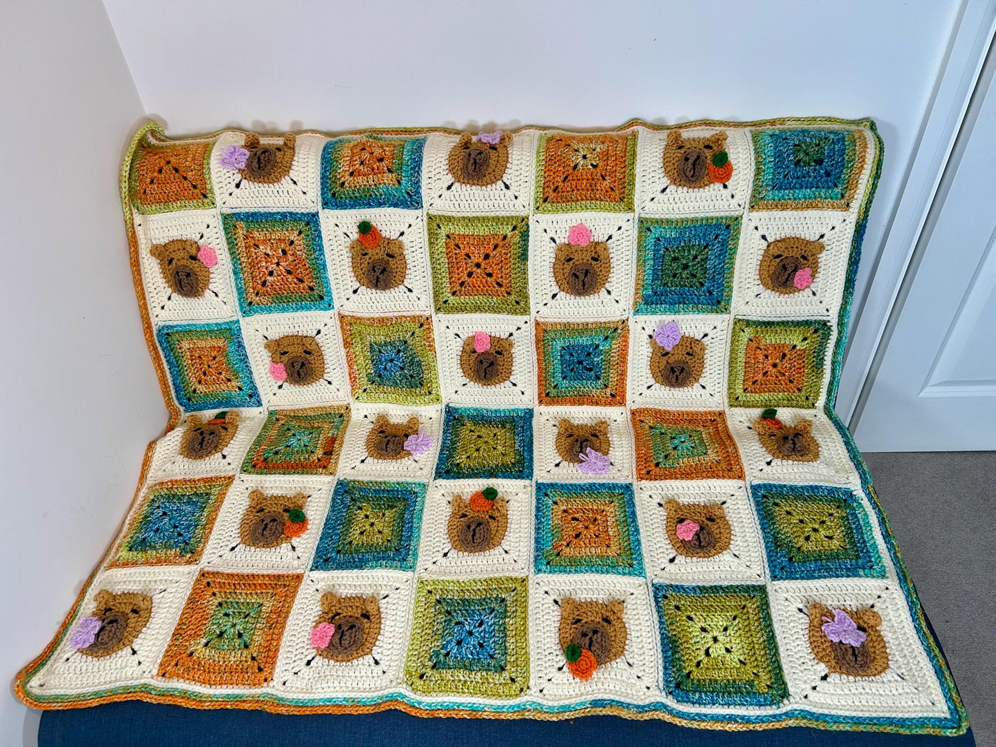 Capybara crochet blanket pattern. PDF download, UK and US terms. Bright colors.