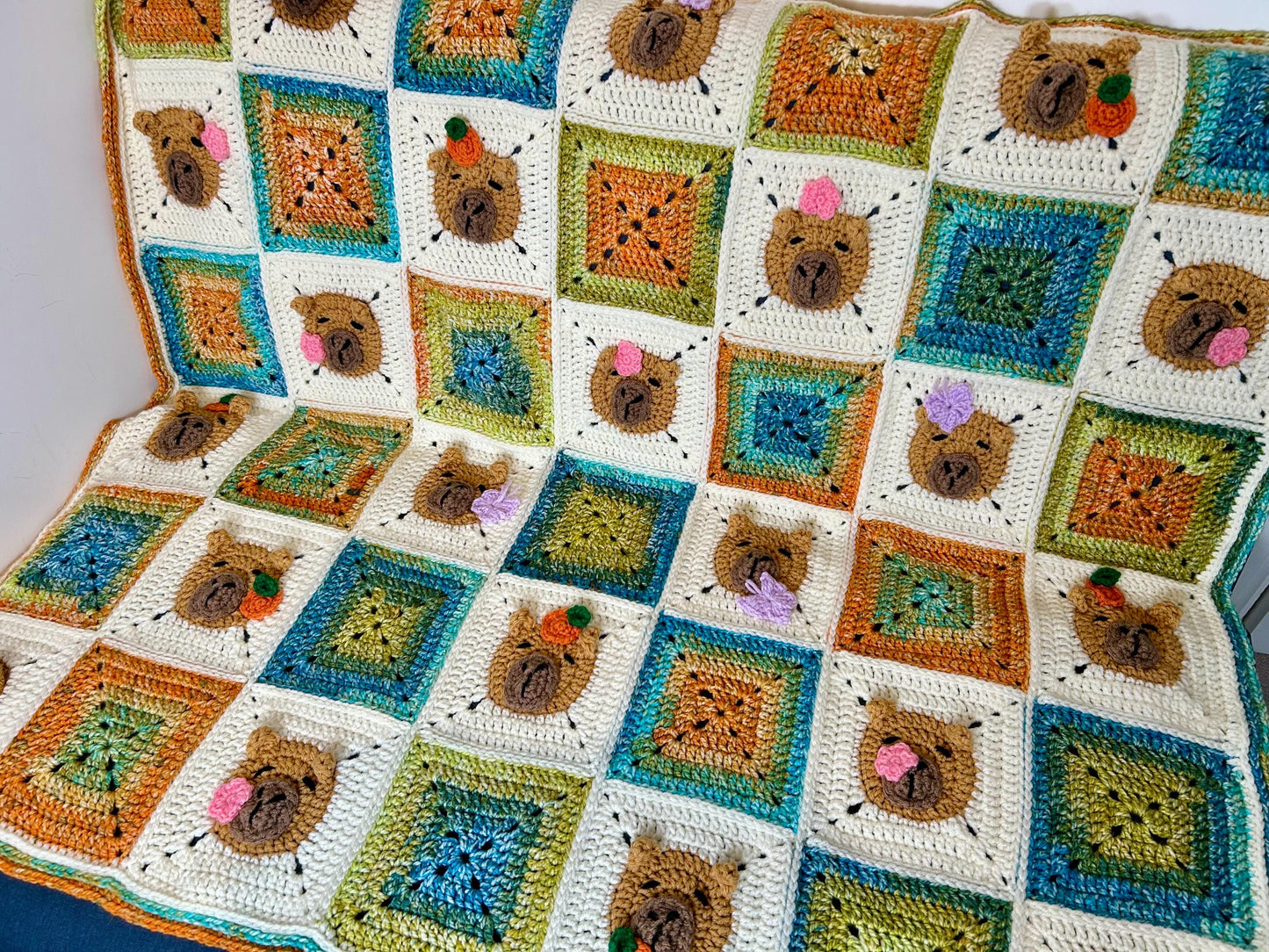 Capybara crochet blanket pattern. PDF download, UK and US terms. Bright colors.