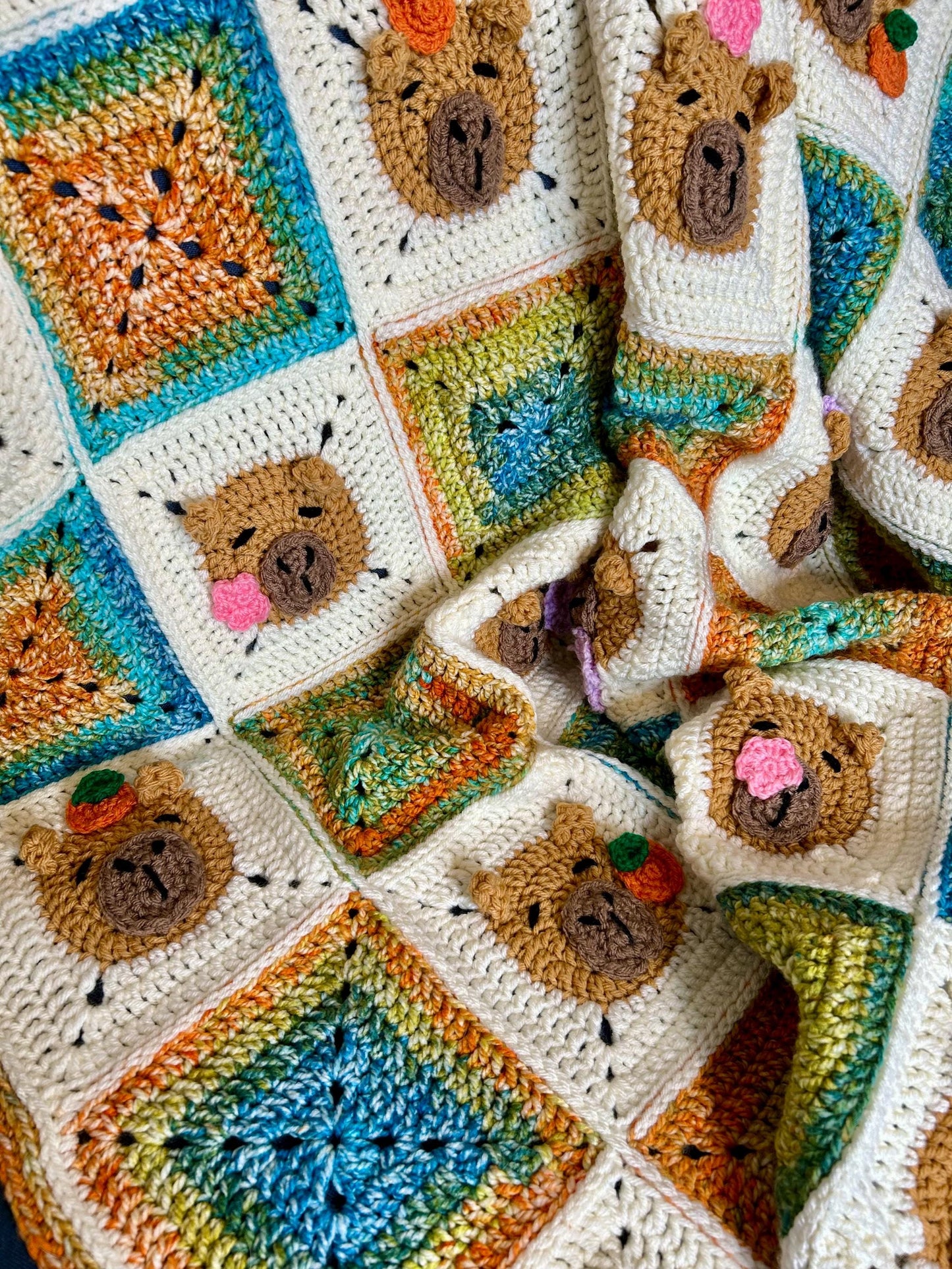 Capybara crochet blanket pattern. PDF download, UK and US terms. Bright colors.