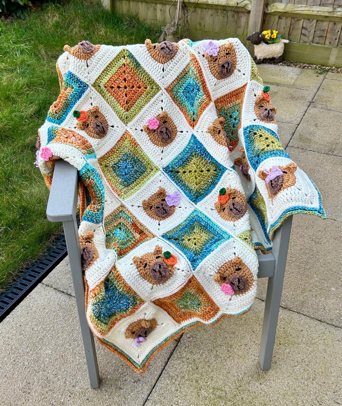 Capybara crochet blanket pattern. PDF download, UK and US terms. Bright colors.